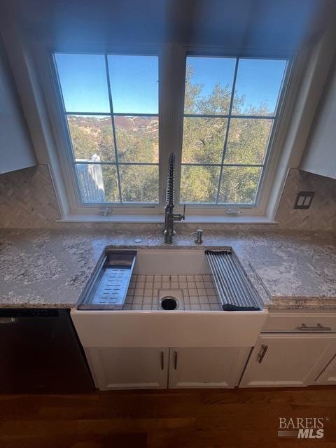 interior details with light countertops and white cabinets