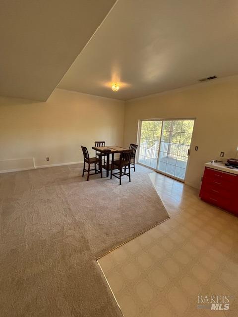 dining room with visible vents and baseboards