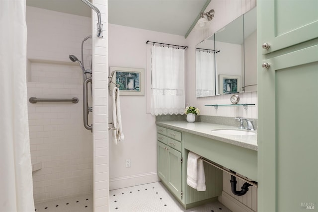 bathroom featuring a shower with curtain, tile patterned flooring, and vanity