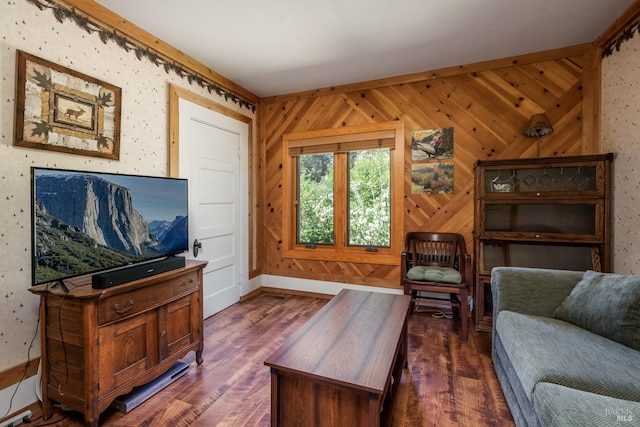 living room featuring dark hardwood / wood-style floors and wooden walls