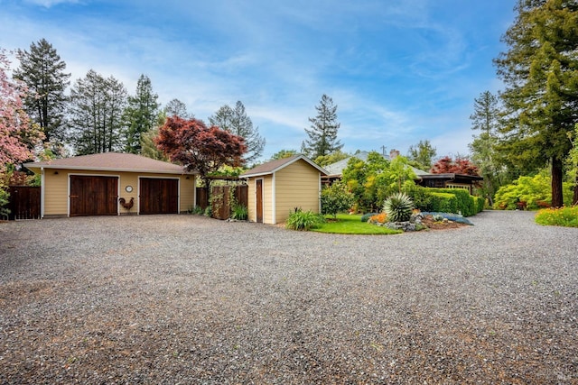 ranch-style home with an outbuilding