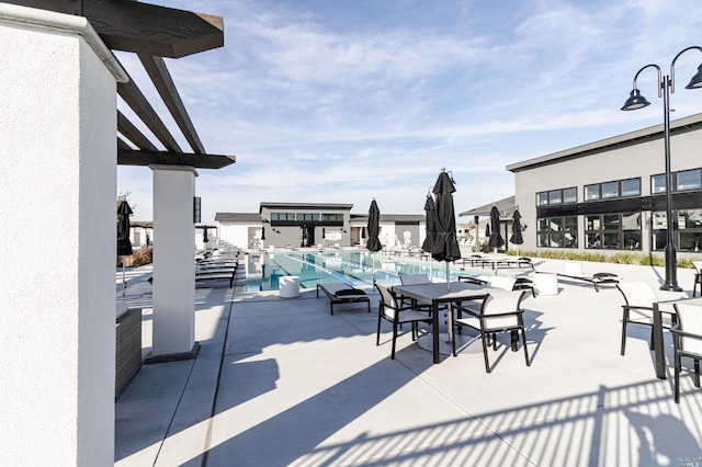 view of patio with a community pool