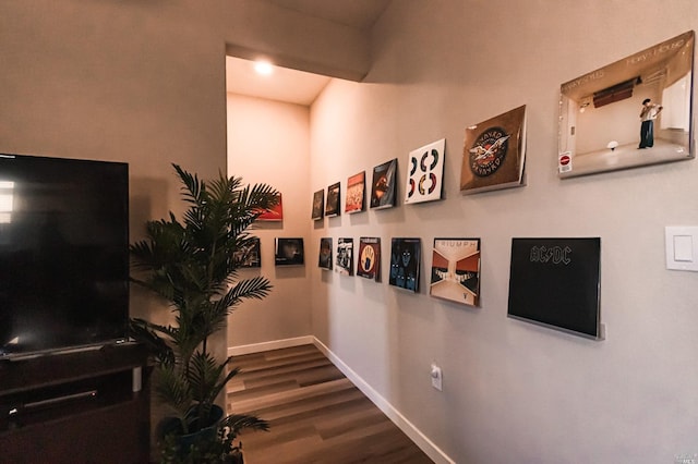 hallway with wood-type flooring