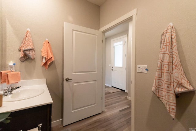 bathroom featuring wood-type flooring and vanity