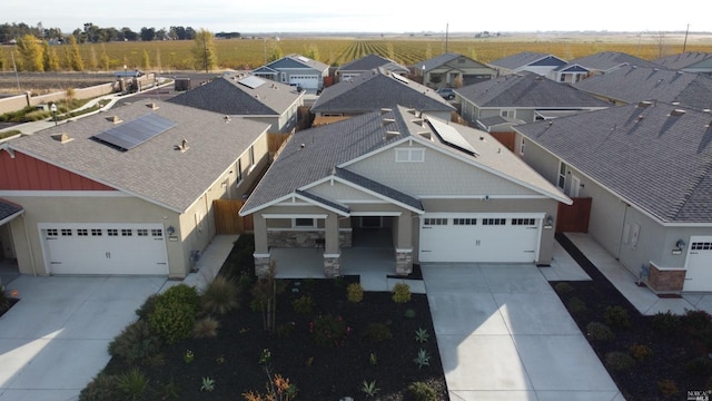 craftsman-style home with solar panels