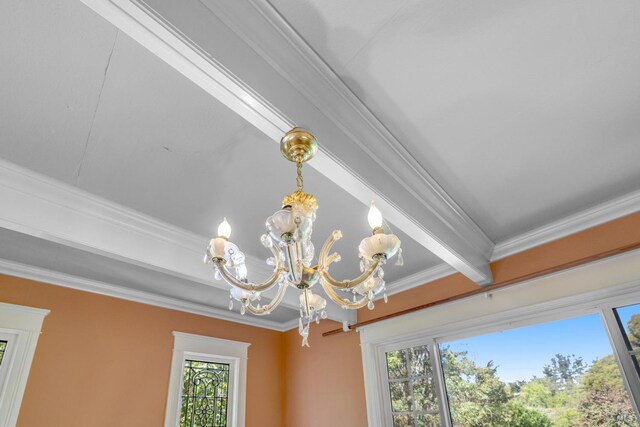 room details with beamed ceiling, ornamental molding, and a chandelier