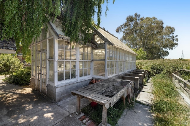 view of side of property featuring an outbuilding