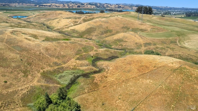 drone / aerial view featuring a rural view and a mountain view