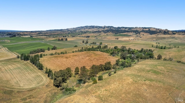 birds eye view of property with a rural view