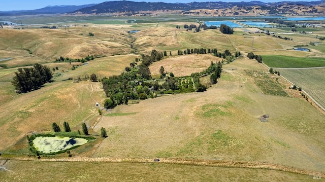 bird's eye view featuring a rural view and a water and mountain view