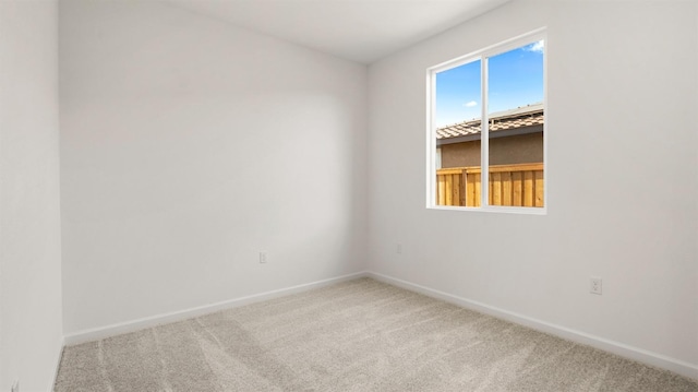 unfurnished room with carpet flooring