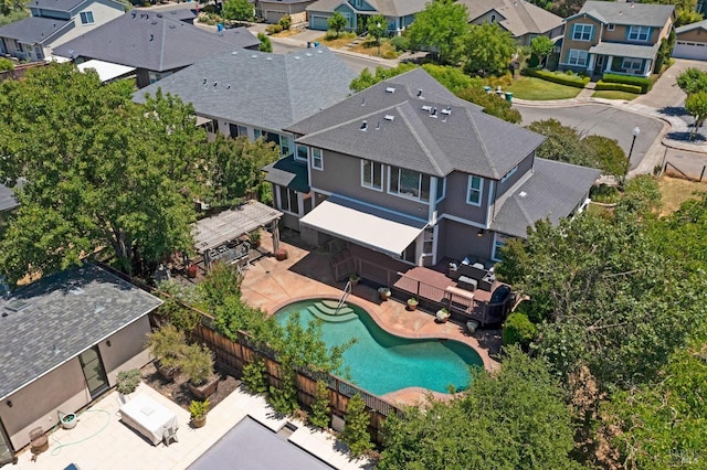 birds eye view of property with a residential view