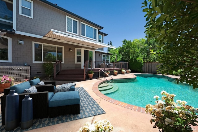 view of swimming pool featuring fence, a fenced in pool, a deck, and a patio area