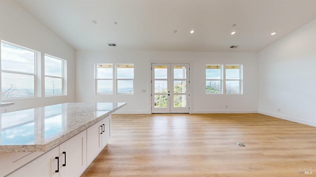 interior space featuring light hardwood / wood-style flooring and french doors