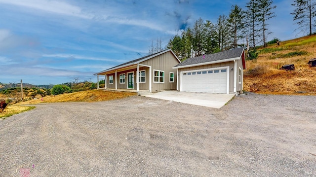 view of front of home with a garage and a porch