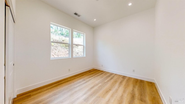 unfurnished room featuring light wood-type flooring