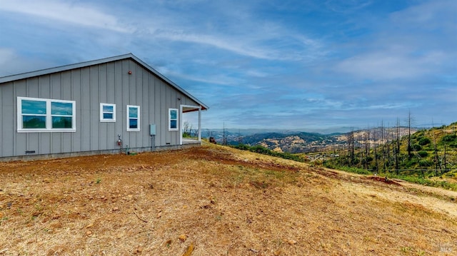 view of home's exterior featuring a mountain view