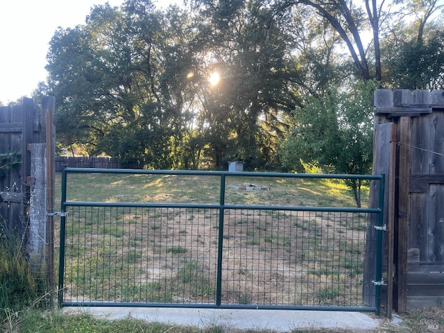 view of gate with fence