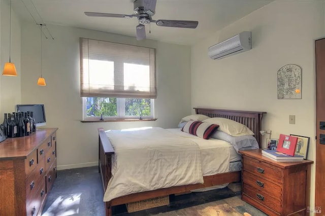 bedroom with a ceiling fan, baseboards, and an AC wall unit