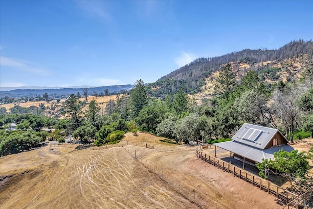 drone / aerial view featuring a rural view and a mountain view