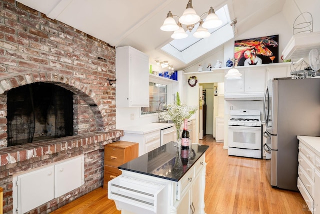 kitchen with white cabinetry, light hardwood / wood-style flooring, lofted ceiling with beams, and white appliances