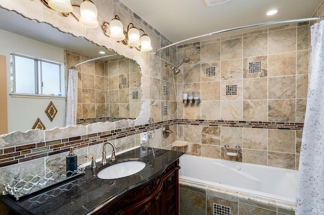 bathroom featuring shower / tub combo with curtain, vanity, and tile walls