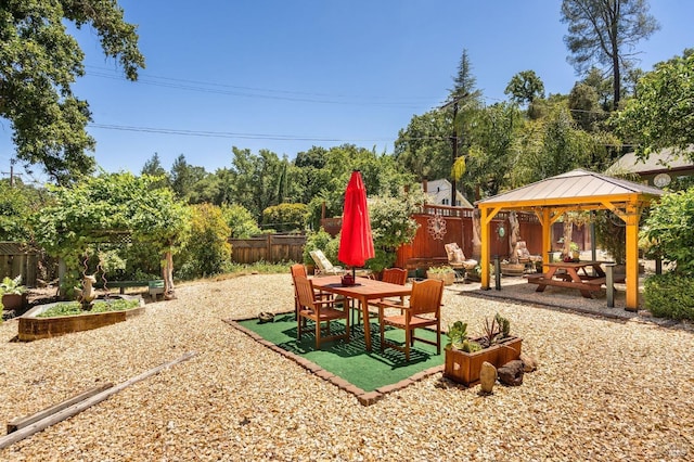 view of playground with a gazebo and a patio