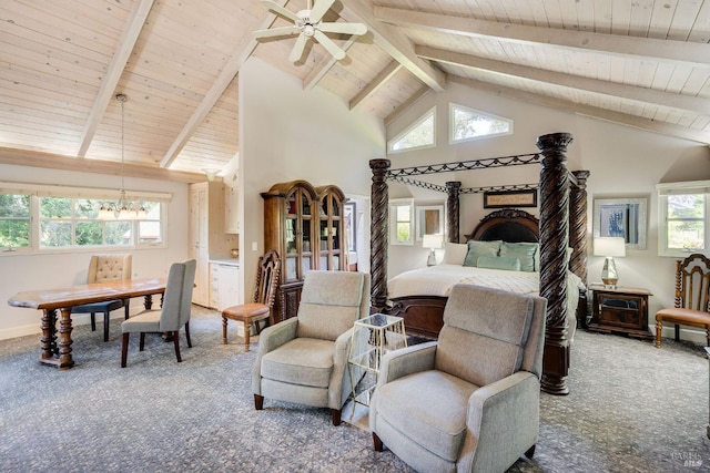 carpeted bedroom featuring ceiling fan with notable chandelier, beam ceiling, and multiple windows