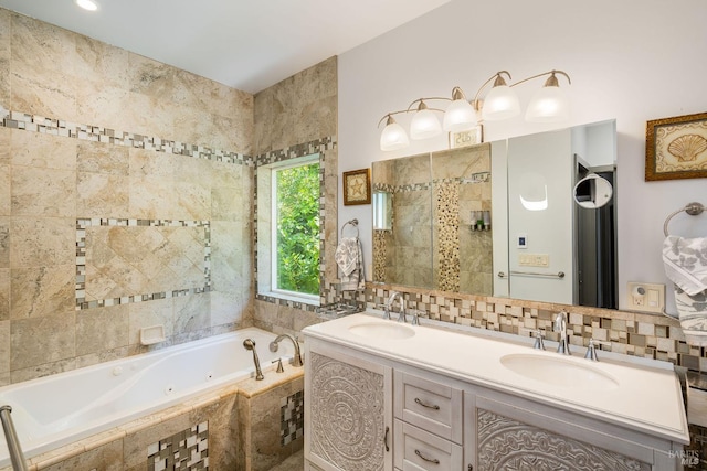 bathroom with vanity and shower with separate bathtub