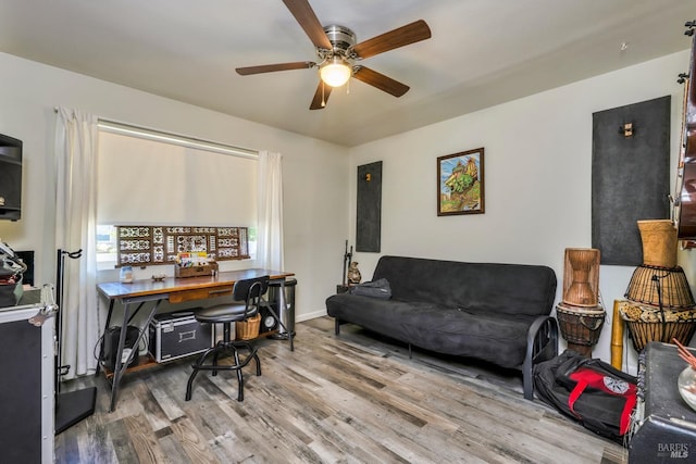 office area with wood-type flooring and ceiling fan