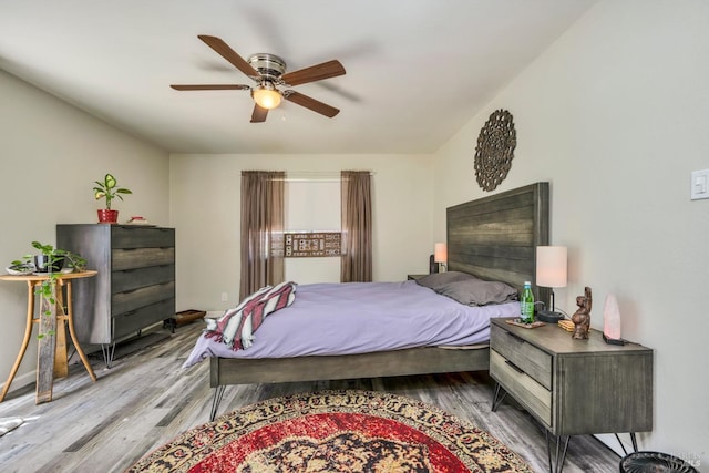 bedroom with ceiling fan and light wood-type flooring