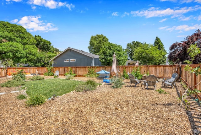 view of yard featuring a fire pit