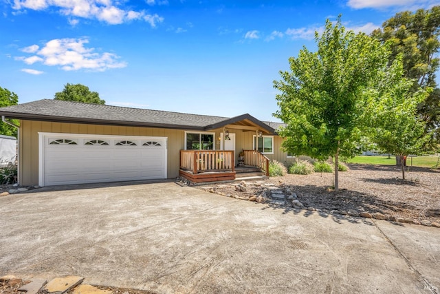 ranch-style house with a porch and a garage