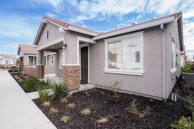 view of front of home featuring central AC unit