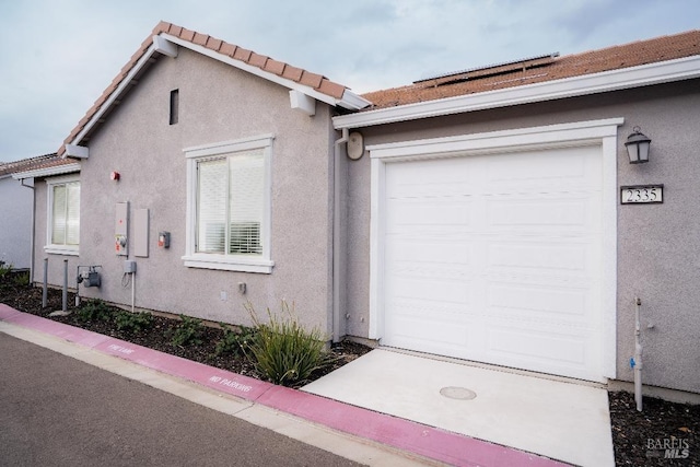 view of side of property featuring a garage