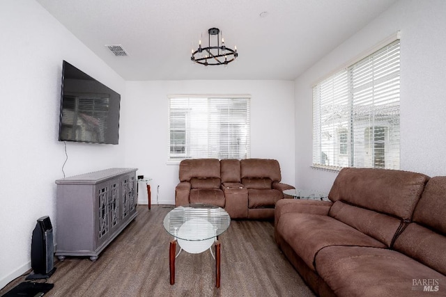 living room with a notable chandelier and a healthy amount of sunlight