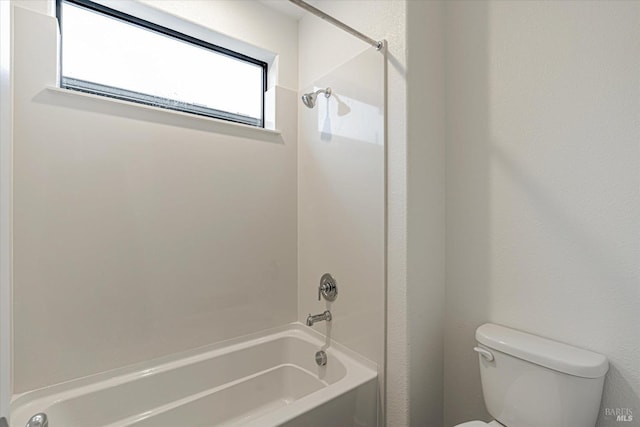 bathroom featuring toilet and bathtub / shower combination