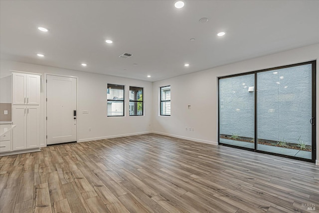 spare room featuring light hardwood / wood-style flooring