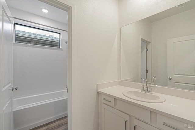 bathroom featuring vanity and wood-type flooring