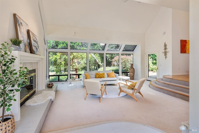 12430 Fiori Ln, Sebastopol, CA 95472 - carpeted living room featuring high vaulted ceiling and a tiled fireplace
