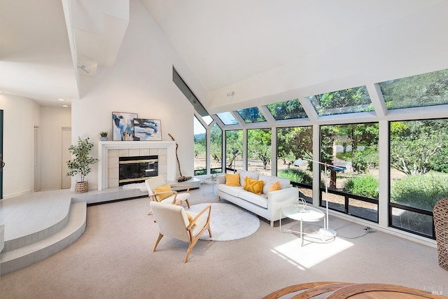 living room featuring a fireplace, carpet flooring, and high vaulted ceiling