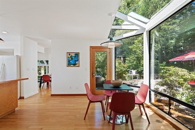 12430 Fiori Ln, Sebastopol, CA 95472 - dining area featuring light wood finished floors, baseboards, and a skylight
