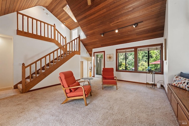 living area with light colored carpet, wooden ceiling, and high vaulted ceiling