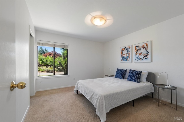 bedroom featuring light colored carpet