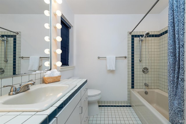 full bathroom featuring tile patterned flooring, vanity, toilet, and shower / tub combo