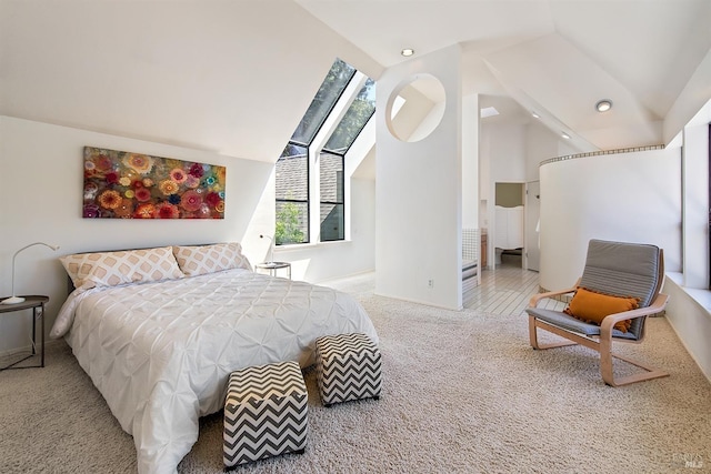 carpeted bedroom with vaulted ceiling