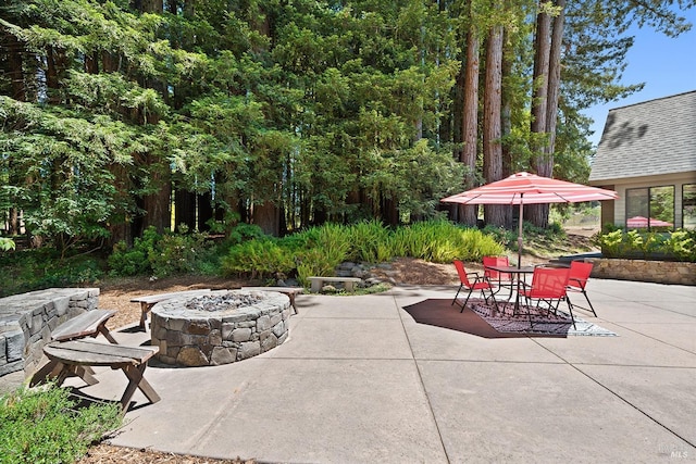 view of patio / terrace featuring a fire pit