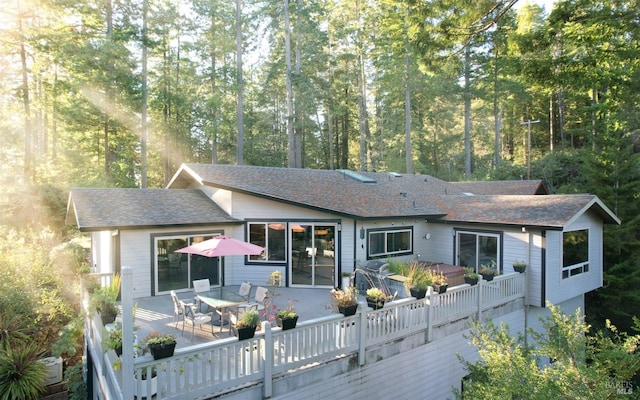 21995 Ansel Ct, Timber Cove, CA 95450 - back of property with outdoor dining space and roof with shingles