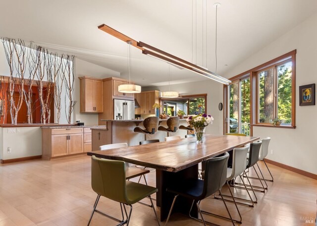 21995 Ansel Ct, Timber Cove, CA 95450 - dining space with plenty of natural light, baseboards, and light wood-type flooring
