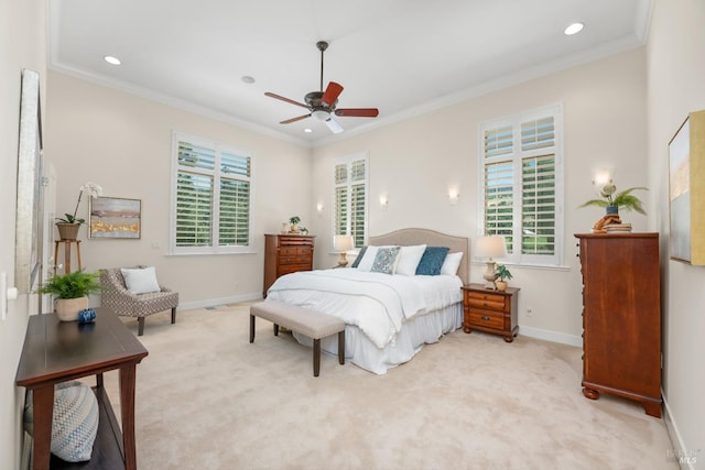 bedroom featuring light colored carpet, crown molding, and baseboards